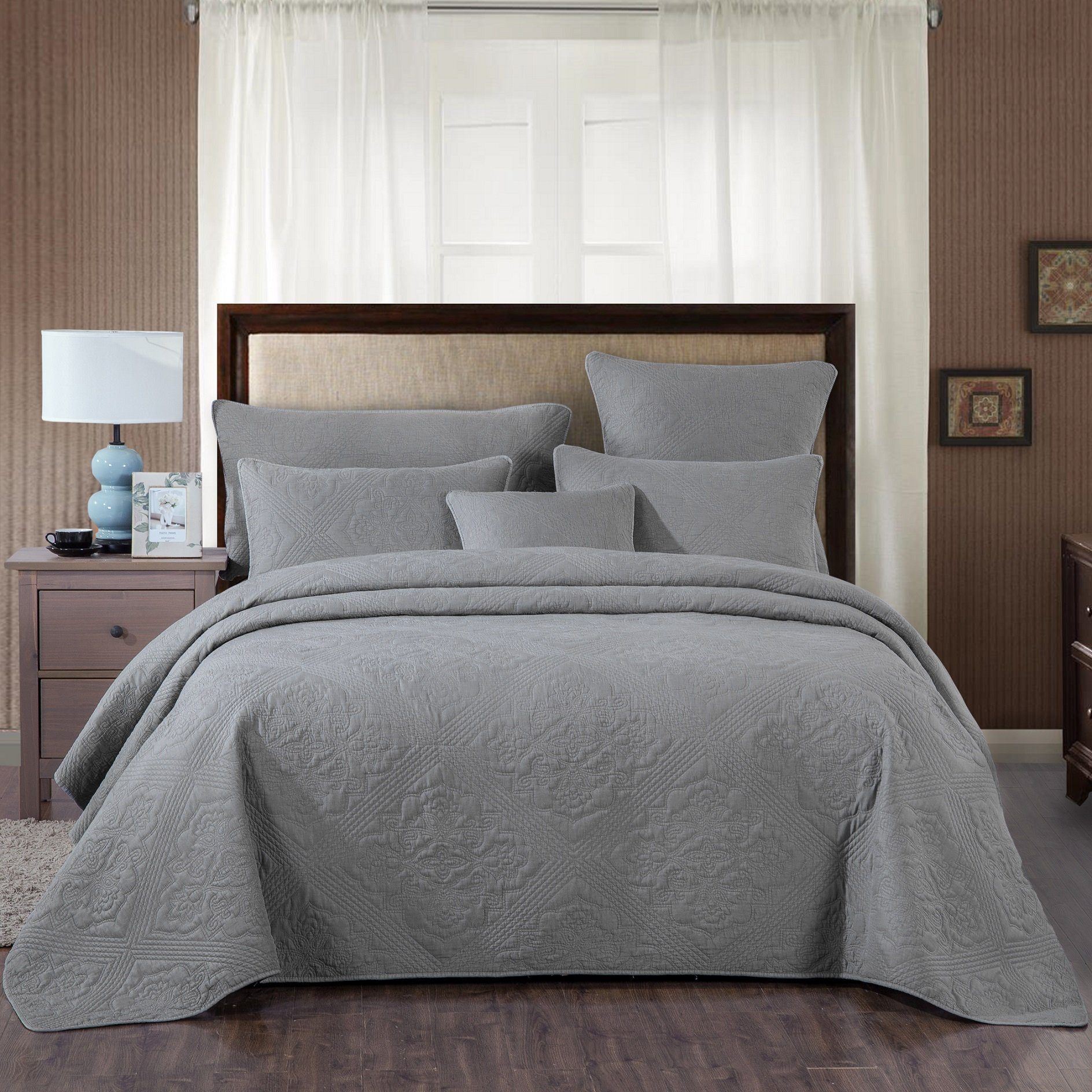 gray matelasse quilt bedspread and pillow covers in bedroom