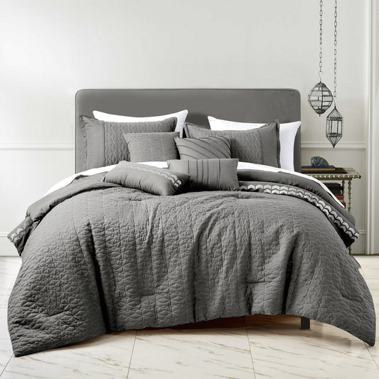 gray comforter set in bedroom showing off the comforter and pillow covers