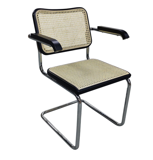 emy armchair with black, chrome, and rattan details