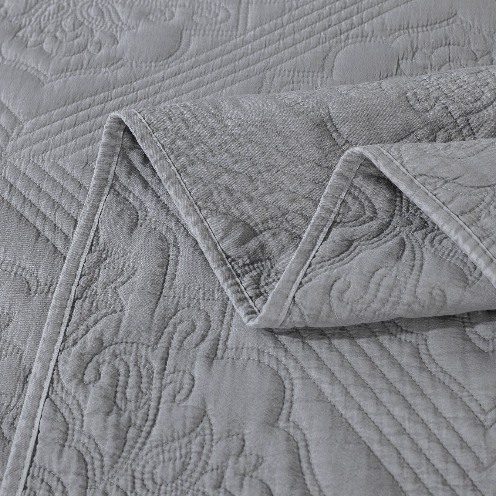 close up pattern of gray matelasse quilt bedspread